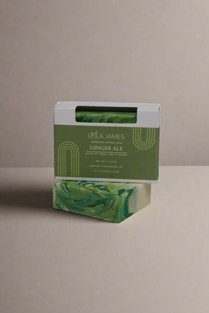 Green soap bar with packaging on a white background