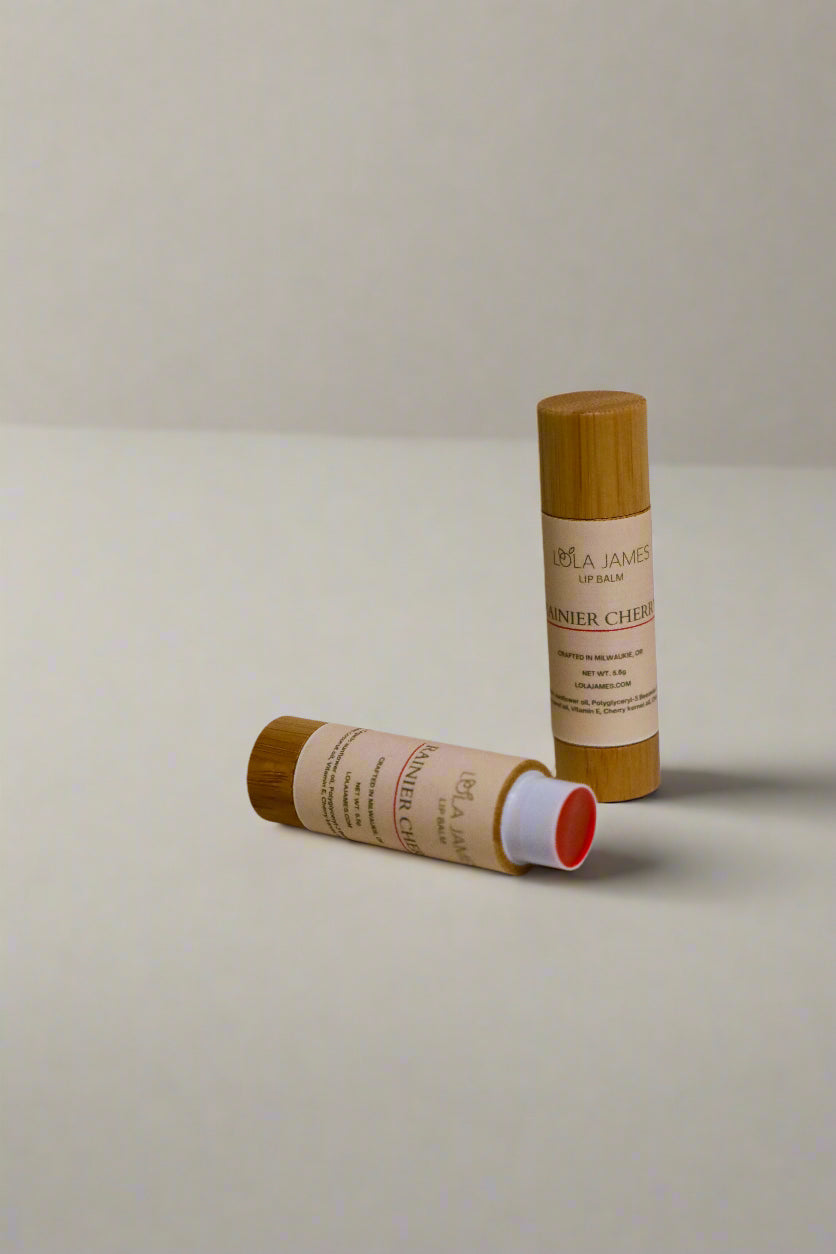 2 bamboo containers of Cherry Lip Balm with a neutral background.
