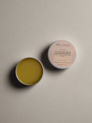 Lola James Staghorn balm in a round container on a white background
